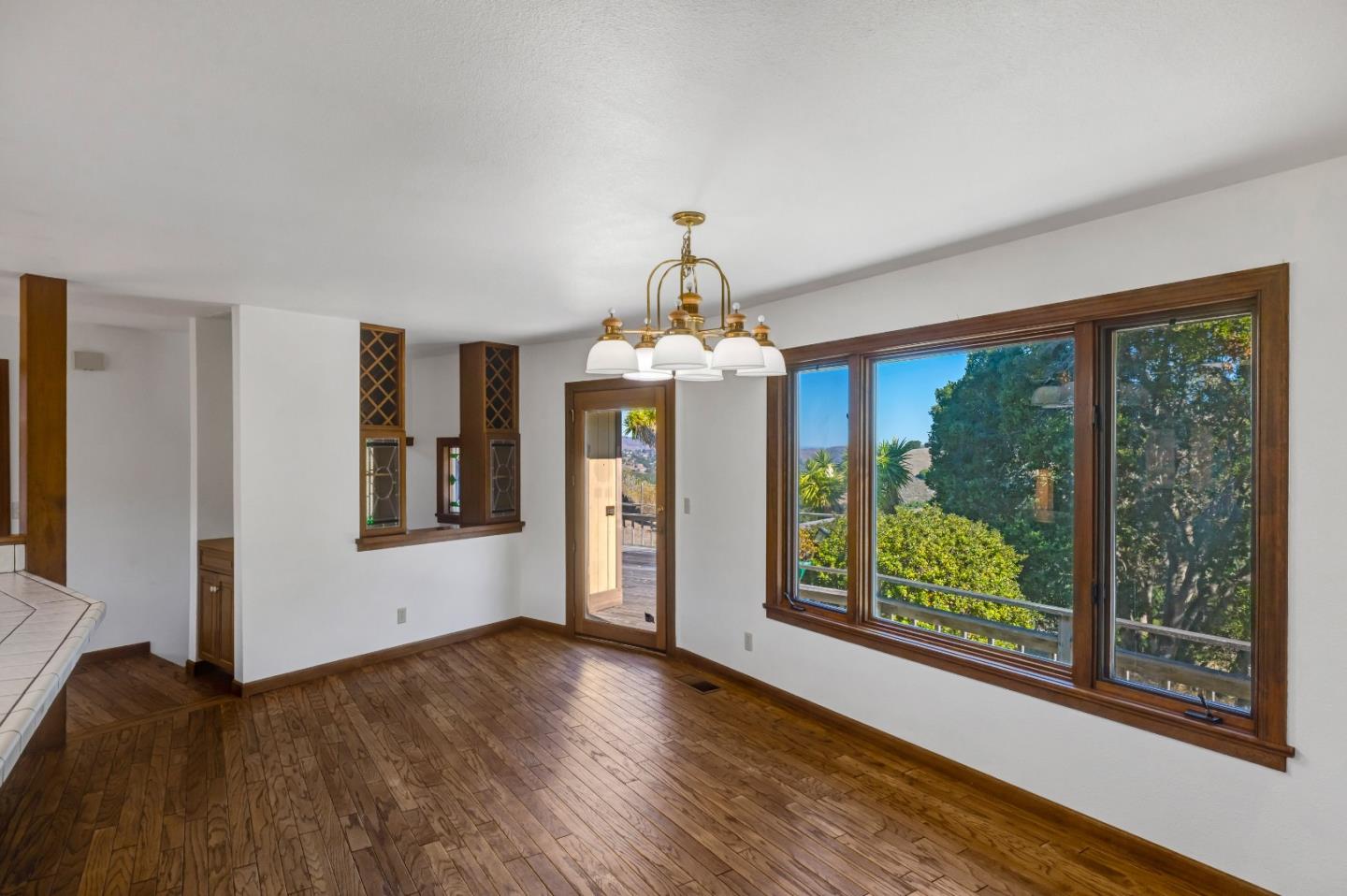 274 Corral De Tierra Road Salinas, CA 93908 - Photo 13 of 46 a view of a room with wooden floors chandelier and windows