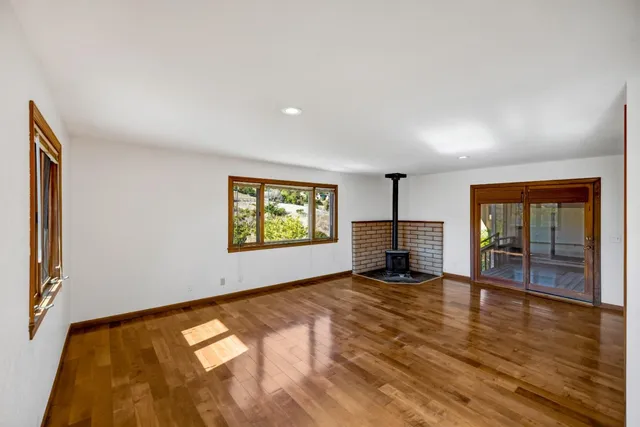a view of an empty room with glass door