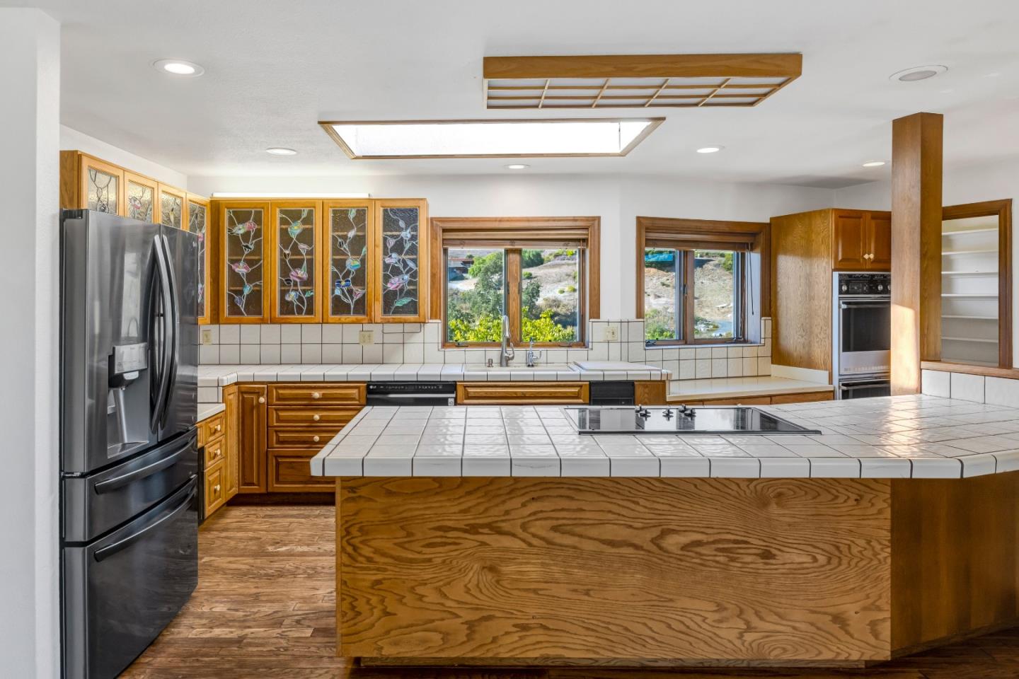 274 Corral De Tierra Road Salinas, CA 93908 - Photo 7 of 46 a kitchen with stainless steel appliances granite countertop a refrigerator and a stove