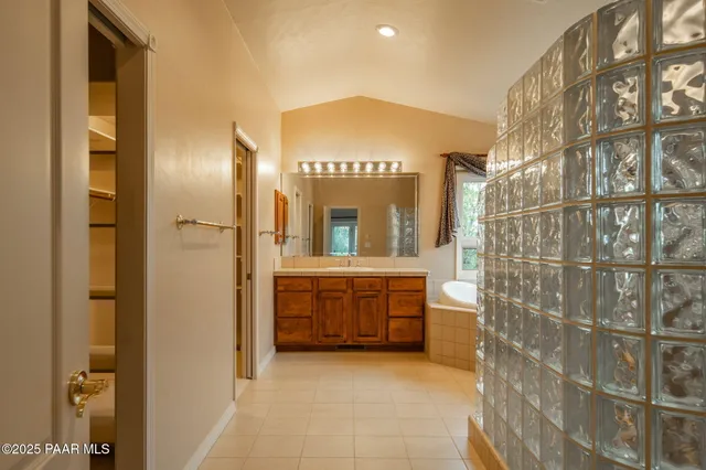 a large spacious bathroom with a large tub and sink
