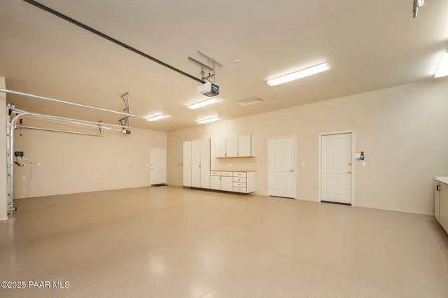 a view of a kitchen with a sink and cabinets