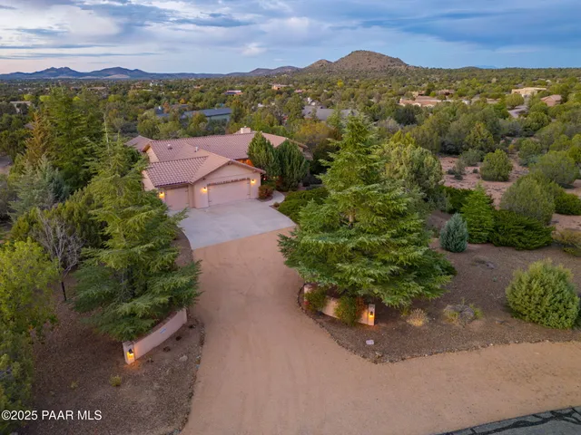an aerial view of a house with a garden