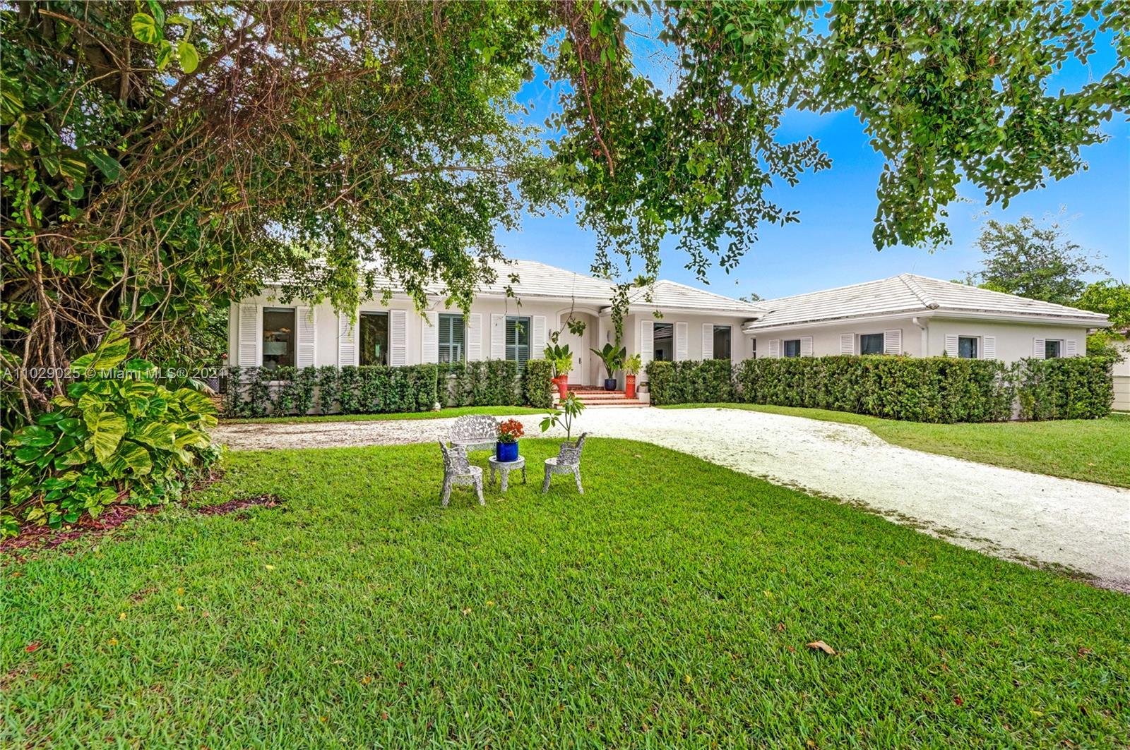 a front view of house with yard and green space