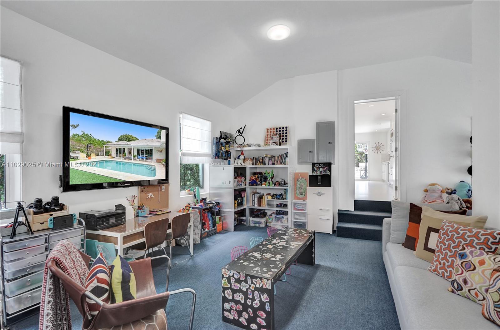 4425 Island Road Miami, FL 33137 - Photo 18 of 30 a living room with furniture and a flat screen tv