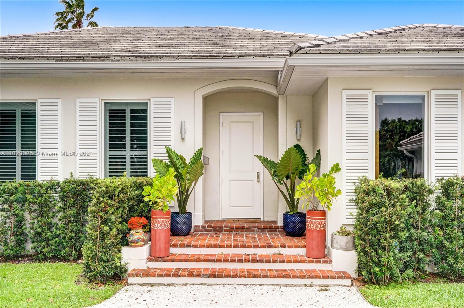 4425 Island Road Miami, FL 33137 - Photo 2 of 30 a view of a house with potted plants