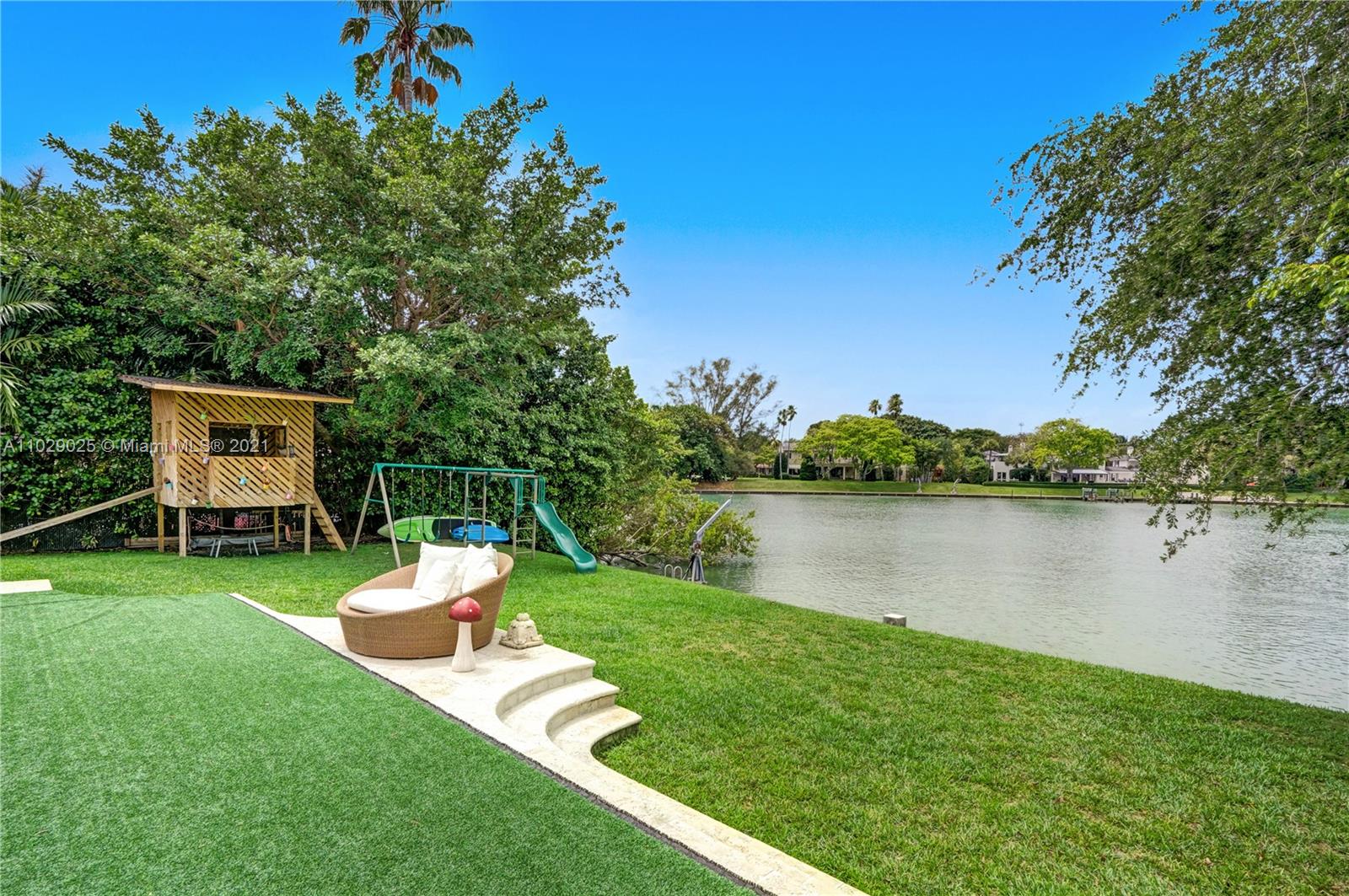 4425 Island Road Miami, FL 33137 - Photo 27 of 30 a view of a house with a yard and a lake view