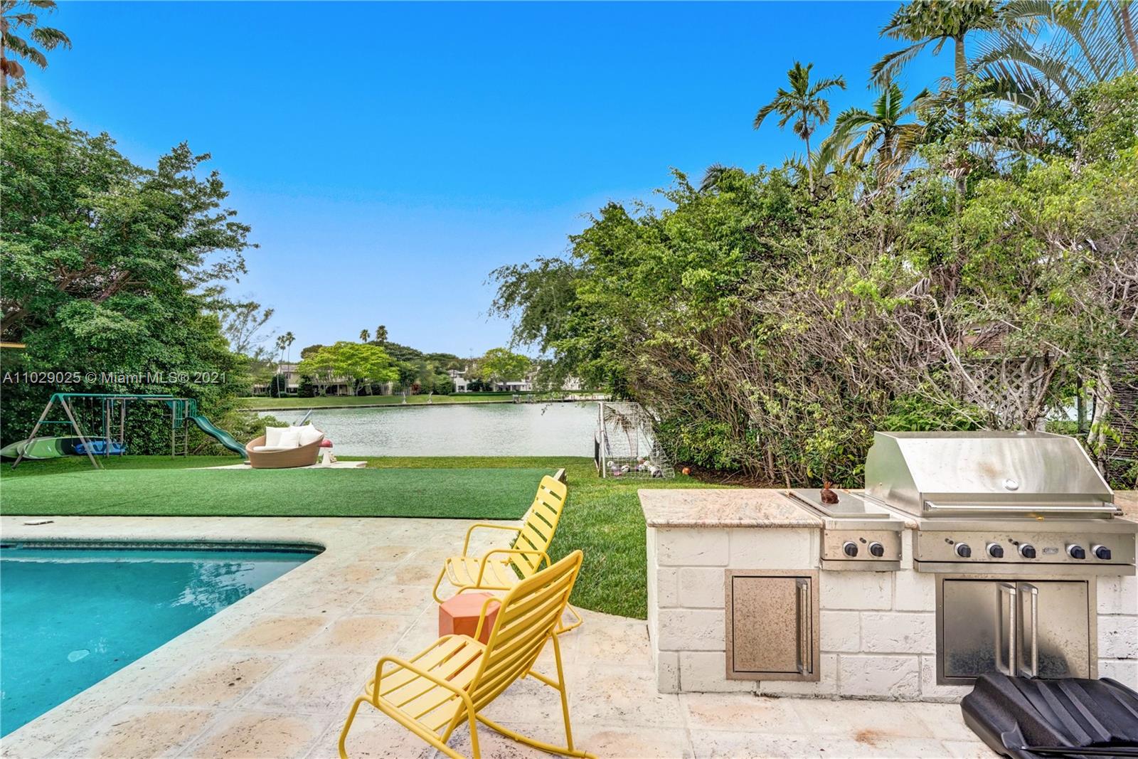 4425 Island Road Miami, FL 33137 - Photo 30 of 30 a view of a swimming pool and a yard