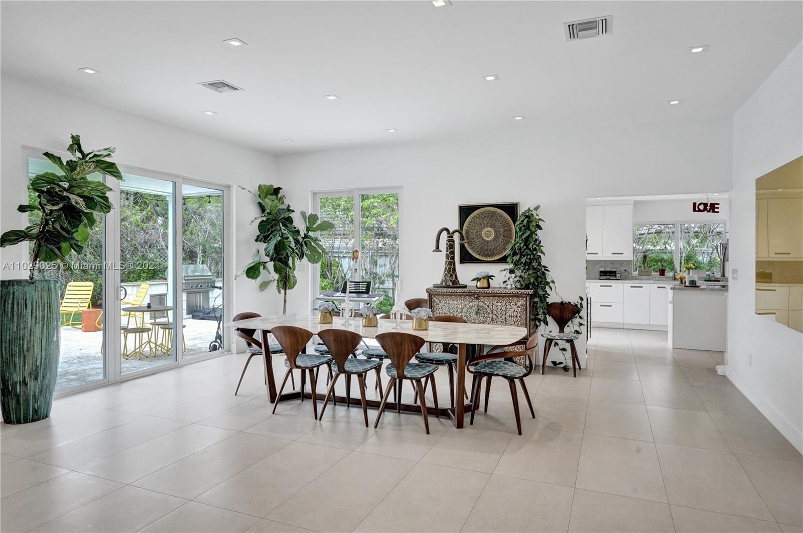 4425 Island Road Miami, FL 33137 - Photo 6 of 30 a view of a dining room with furniture window and outside view