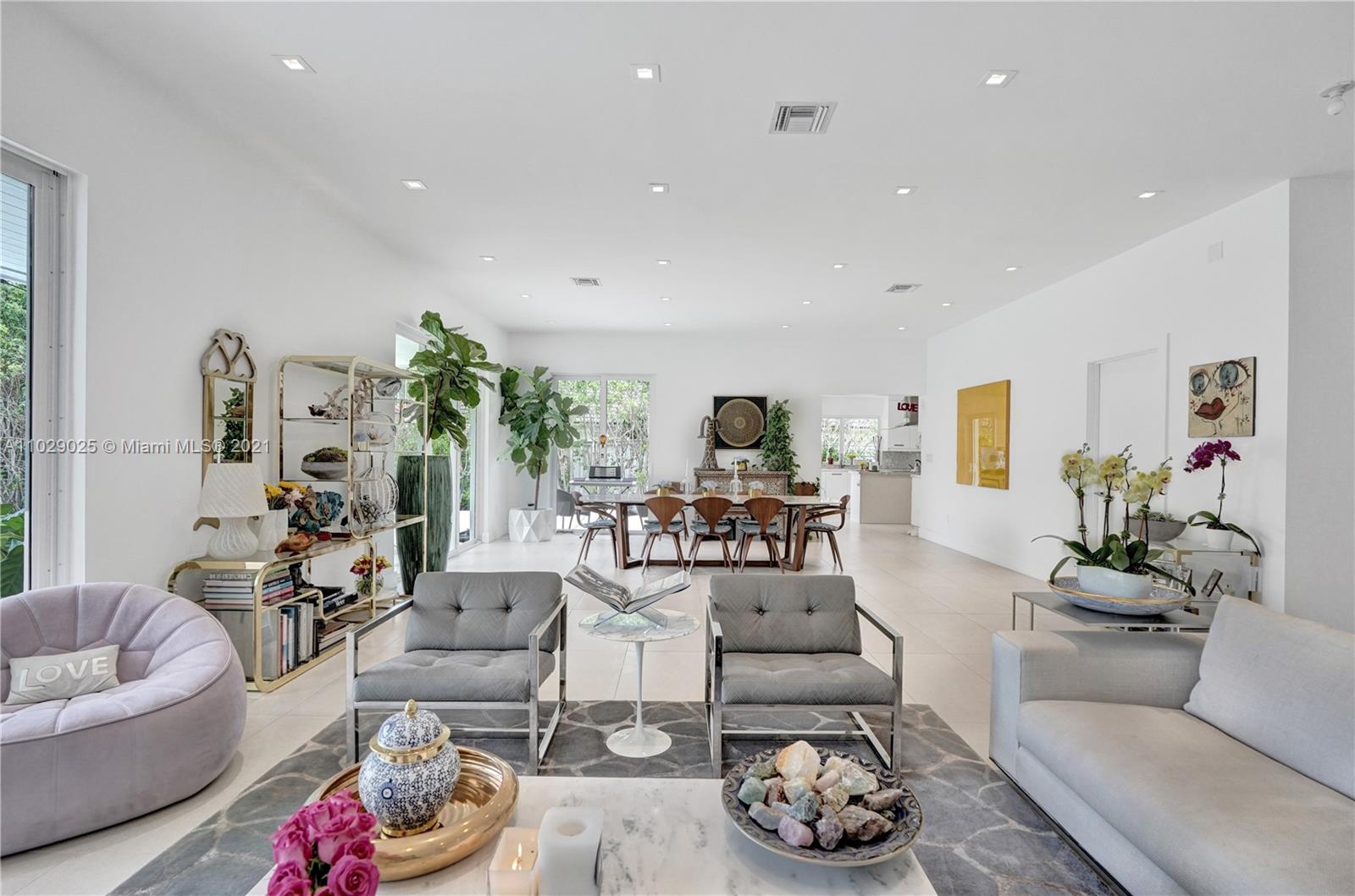 4425 Island Road Miami, FL 33137 - Photo 10 of 30 a living room with furniture and a floor to ceiling window