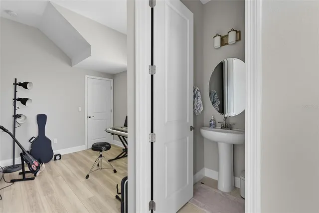 a view of a hallway with a livingroom and a window
