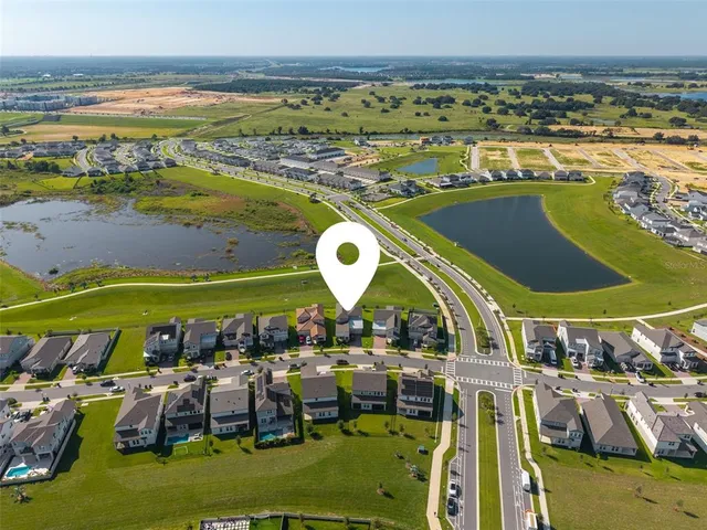 a view of a workspace with wooden floor