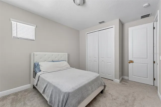 a bed room with a bed and a window