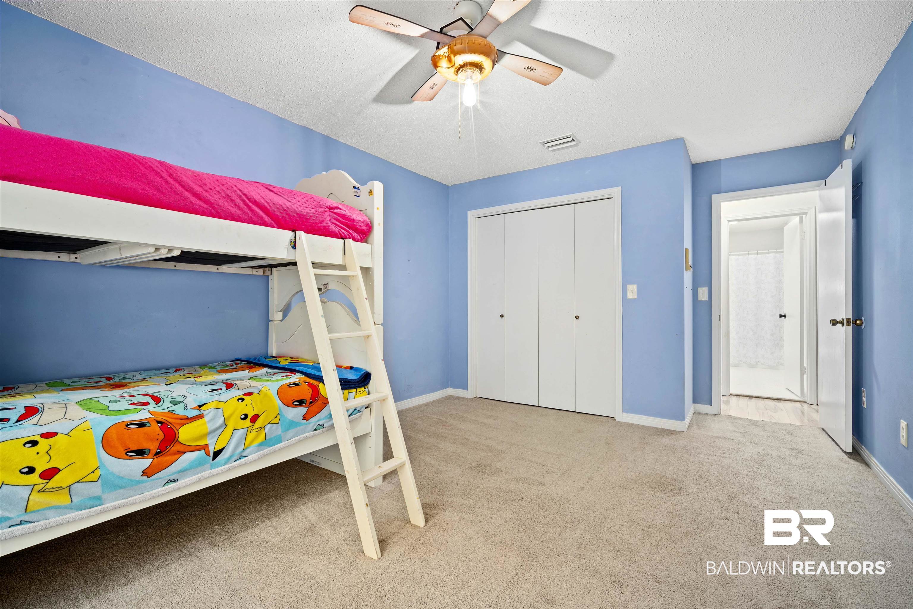 7807 Yorkhaven Road Mobile, AL 36695 - Photo 16 of 34 Bedroom with light carpet, ceiling fan, a textured ceiling, and a closet