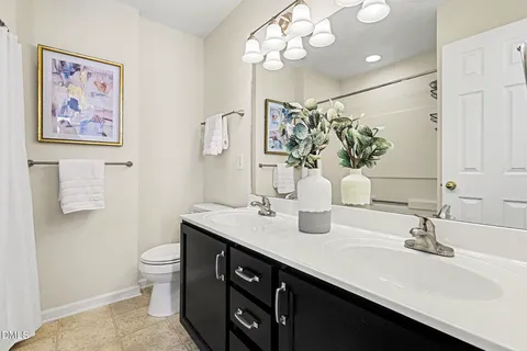 a spacious bedroom with a bed and a window