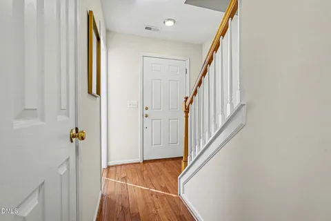 a picture of a bench in front of a house