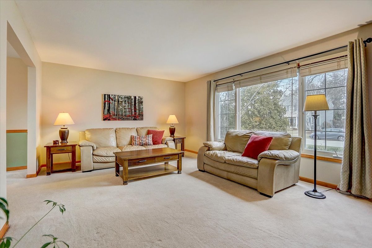 827 Manchester Street Naperville, IL 60563 - Photo 12 of 48 a living room with furniture and a large window