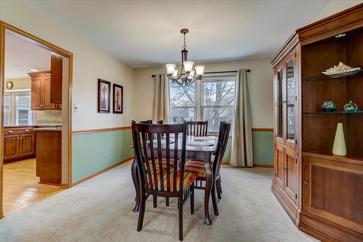 827 Manchester Street Naperville, IL 60563 - Photo 16 of 48 a view of a dining room with furniture and window