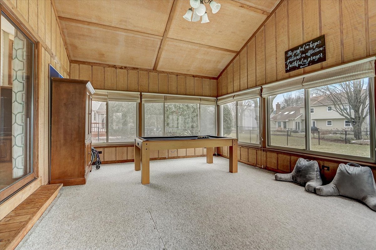 827 Manchester Street Naperville, IL 60563 - Photo 17 of 48 a swimming pool with outdoor seating