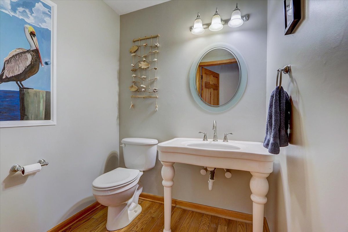 827 Manchester Street Naperville, IL 60563 - Photo 19 of 48 a bathroom with a sink a toilet and a mirror