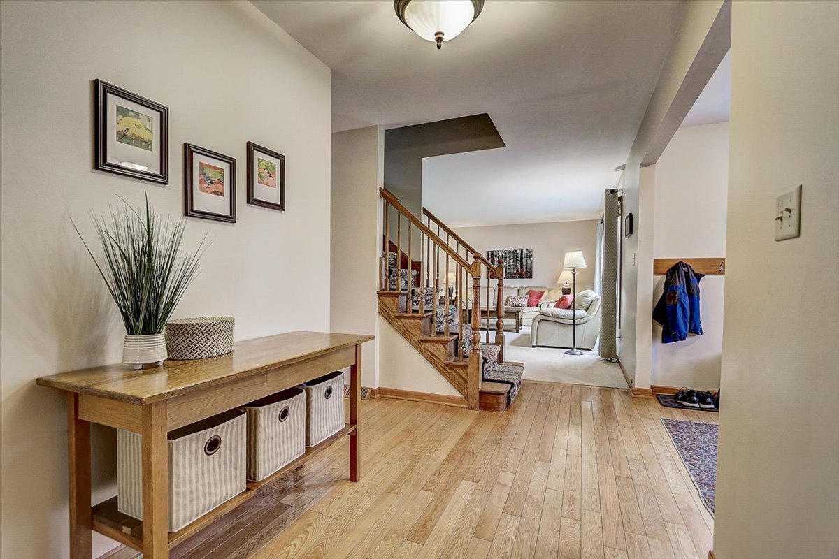 827 Manchester Street Naperville, IL 60563 - Photo 20 of 48 a living room with furniture and a wooden floor