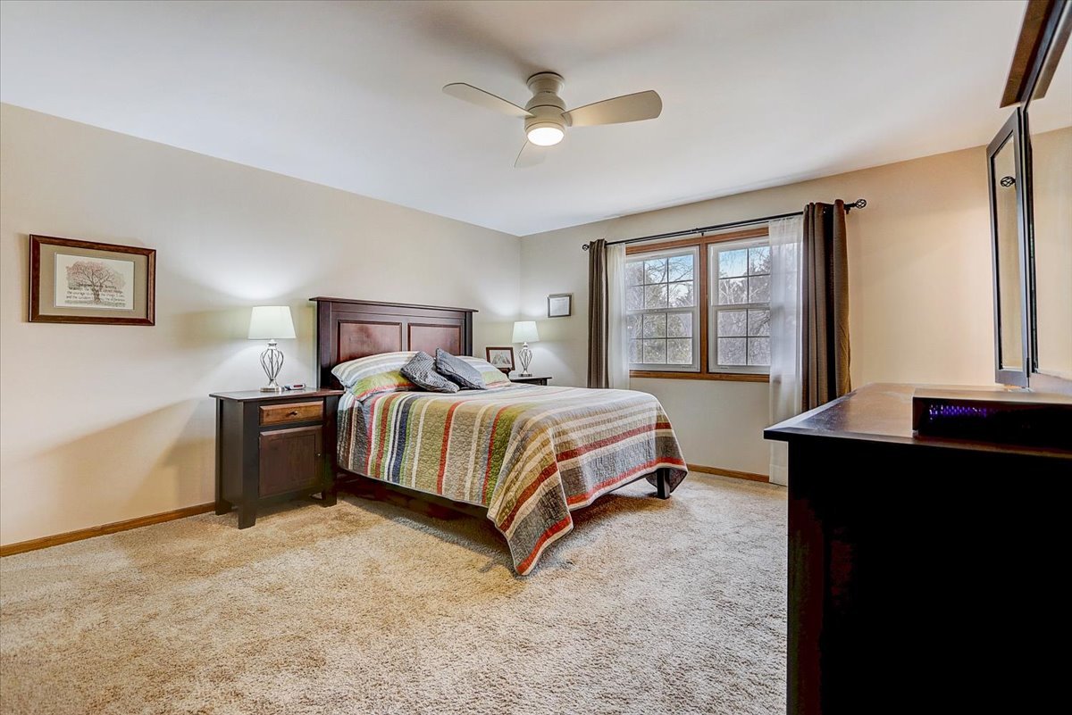 827 Manchester Street Naperville, IL 60563 - Photo 21 of 48 a bedroom with a bed and window