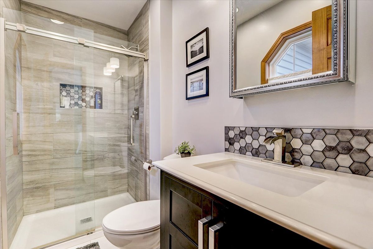 827 Manchester Street Naperville, IL 60563 - Photo 24 of 48 a bathroom with a sink a toilet and shower