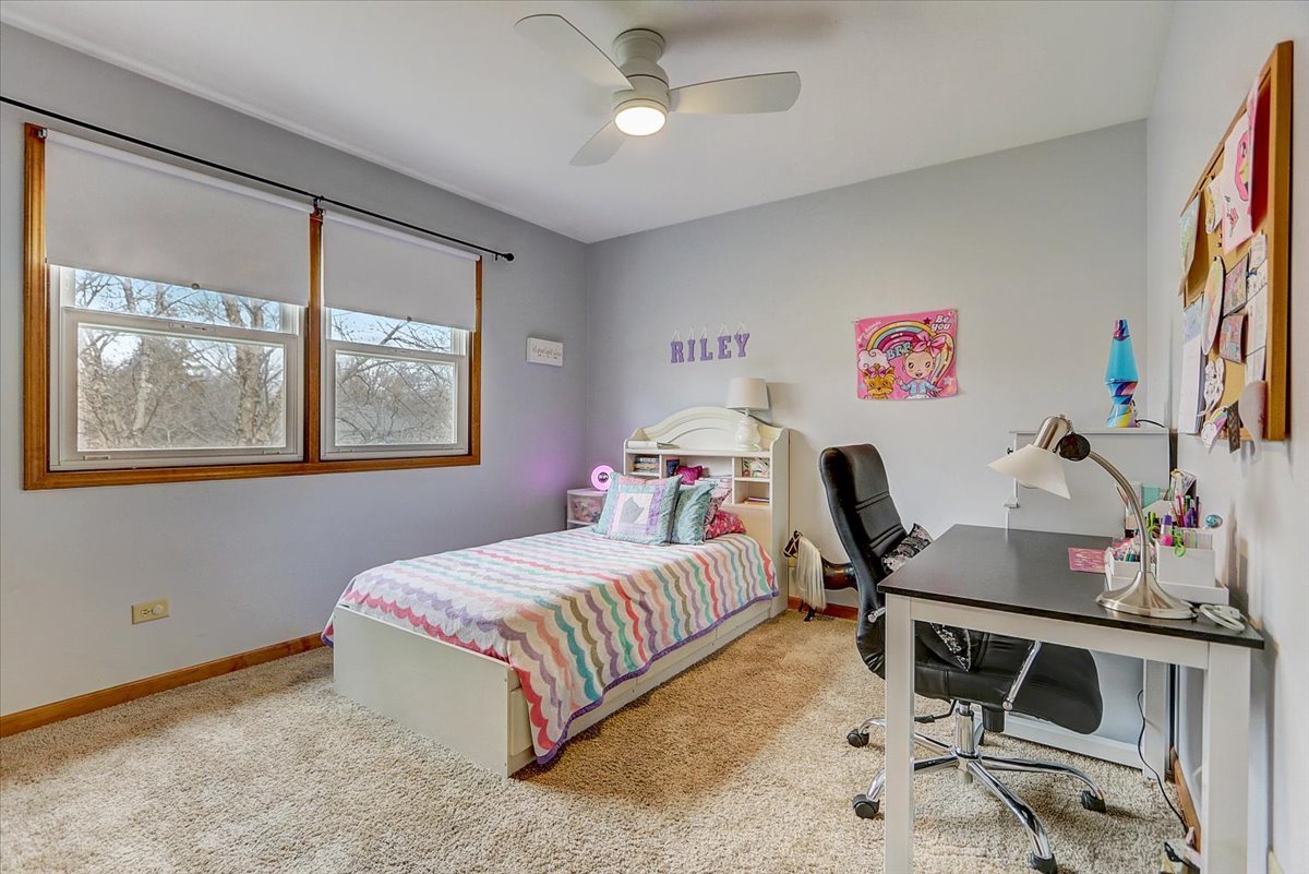 827 Manchester Street Naperville, IL 60563 - Photo 26 of 48 a bedroom with a bed and a desk