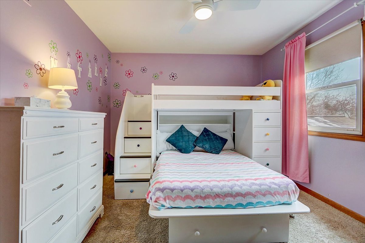 827 Manchester Street Naperville, IL 60563 - Photo 29 of 48 a bedroom with a bed and a dresser