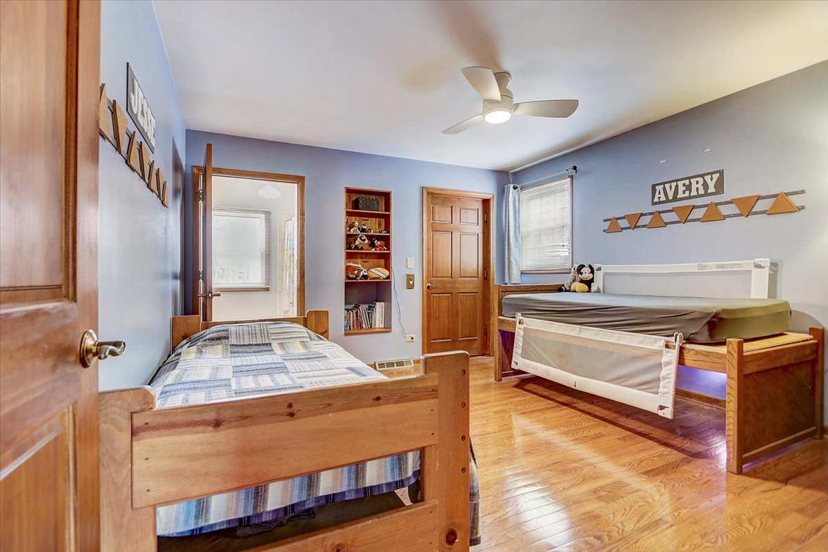 827 Manchester Street Naperville, IL 60563 - Photo 31 of 48 a room with a bed and a dresser in it