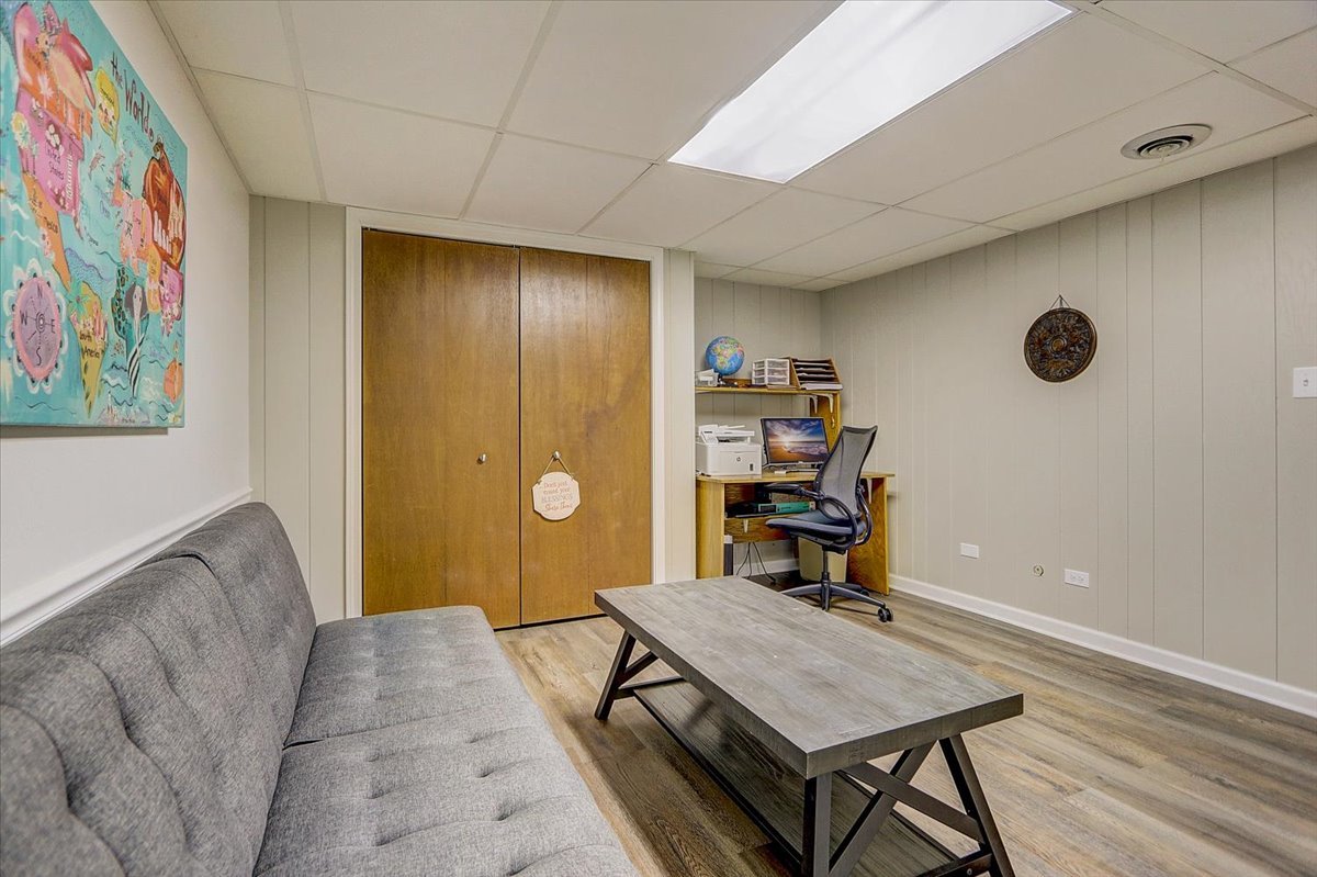 827 Manchester Street Naperville, IL 60563 - Photo 40 of 48 a view of a livingroom with furniture and wooden floor