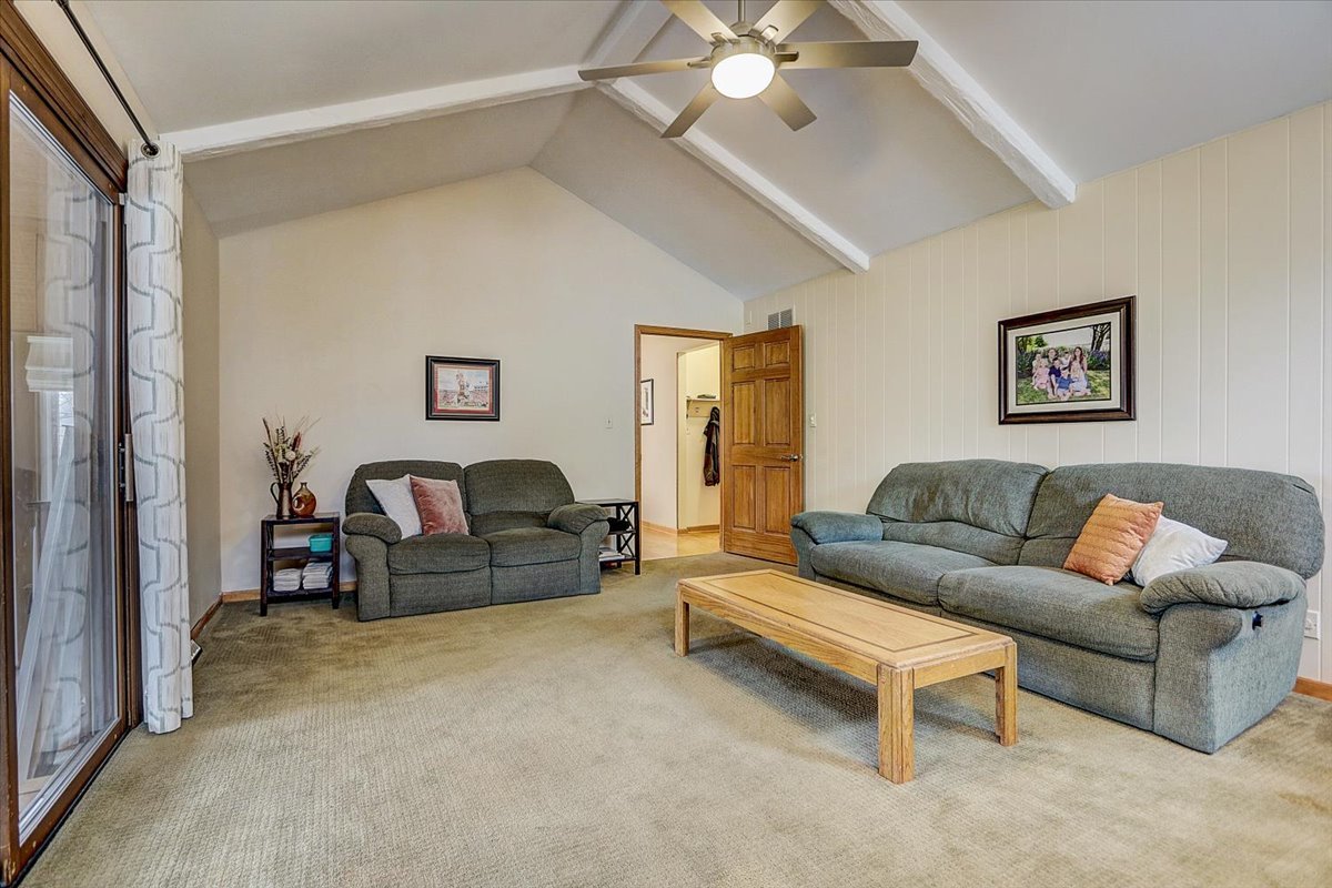 827 Manchester Street Naperville, IL 60563 - Photo 4 of 48 a living room with furniture and a chandelier