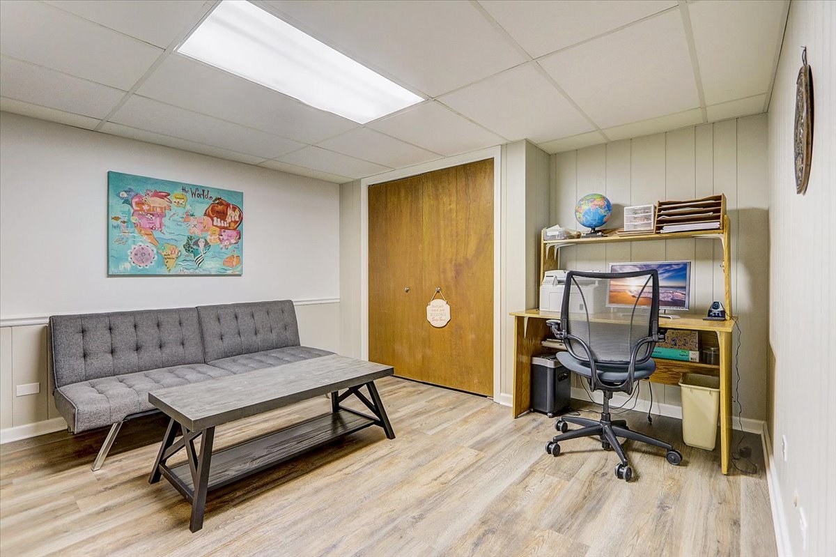 827 Manchester Street Naperville, IL 60563 - Photo 41 of 48 a view of a workspace with furniture and a window