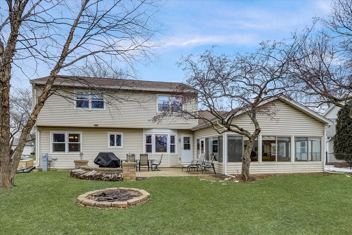 827 Manchester Street Naperville, IL 60563 - Photo 45 of 48 a front view of a house with swimming pool and porch