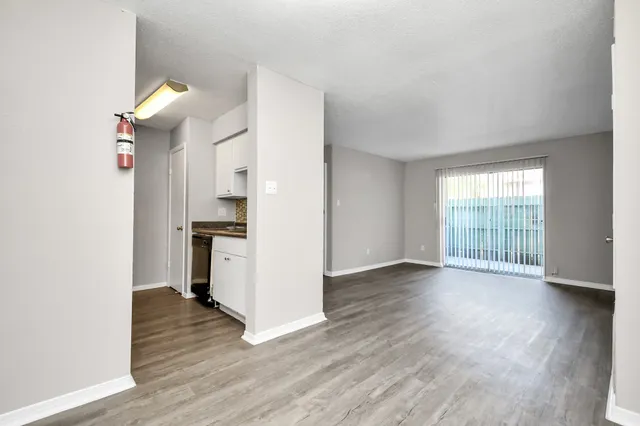 a view of an empty room with a window