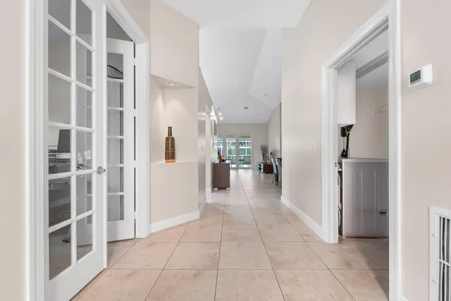 a view of a hallway with wooden shelves