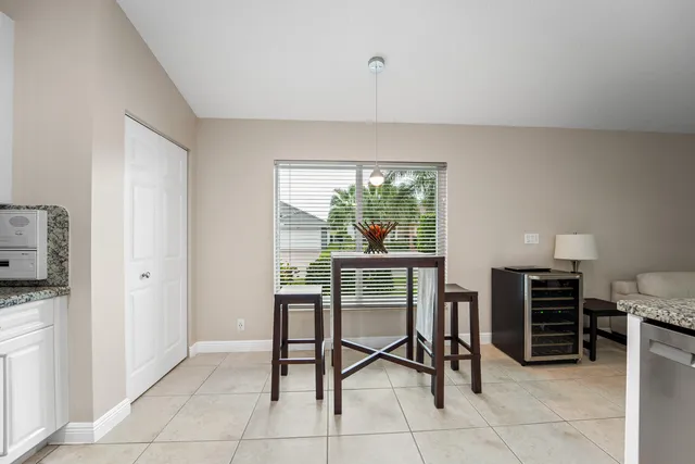 a dining room with furniture and window