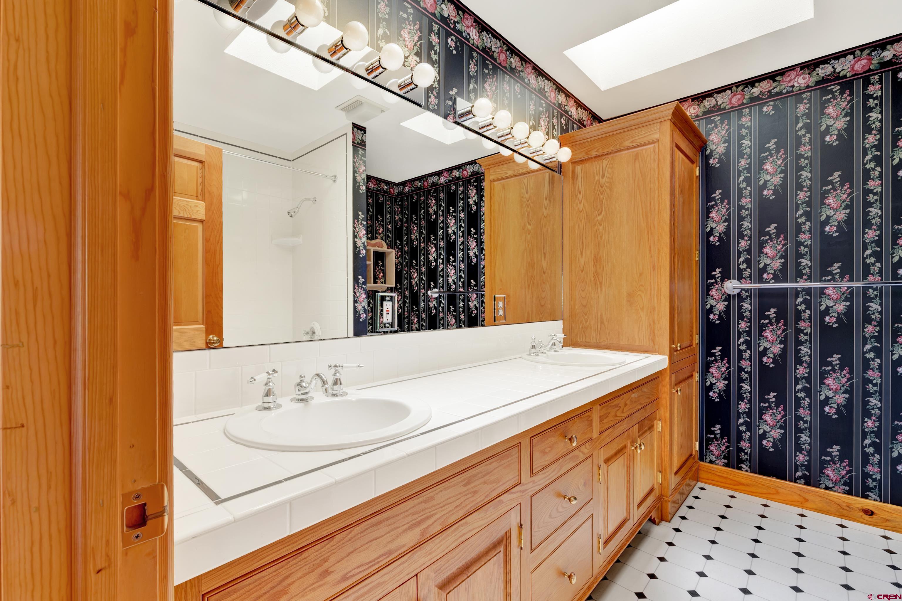 2692 County Road 17 Ridgway, CO 81432 - Photo 25 of 38 a bathroom with a sink and a mirror