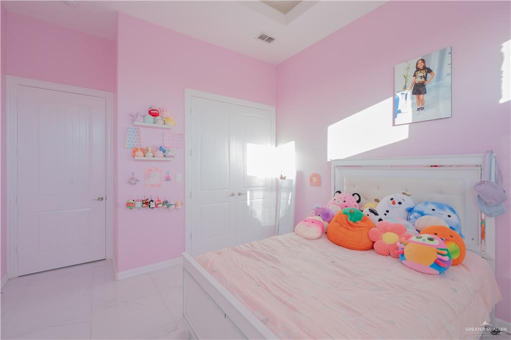 2511 Wisteria Street Rio Grande City, TX 78582 - Photo 10 of 27 a bedroom with a bed and dresser