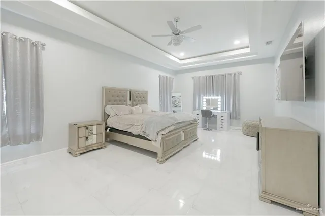 a bedroom with a bed and dresser