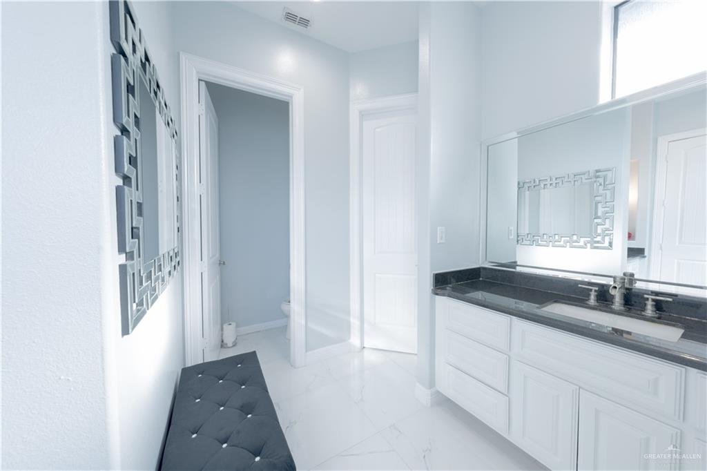 2511 Wisteria Street Rio Grande City, TX 78582 - Photo 17 of 27 a bathroom with a sink and a mirror