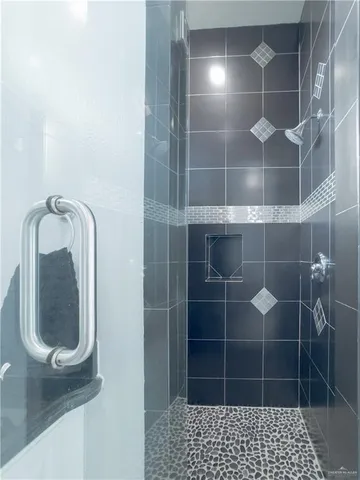 a bathroom with a bathtub and a window