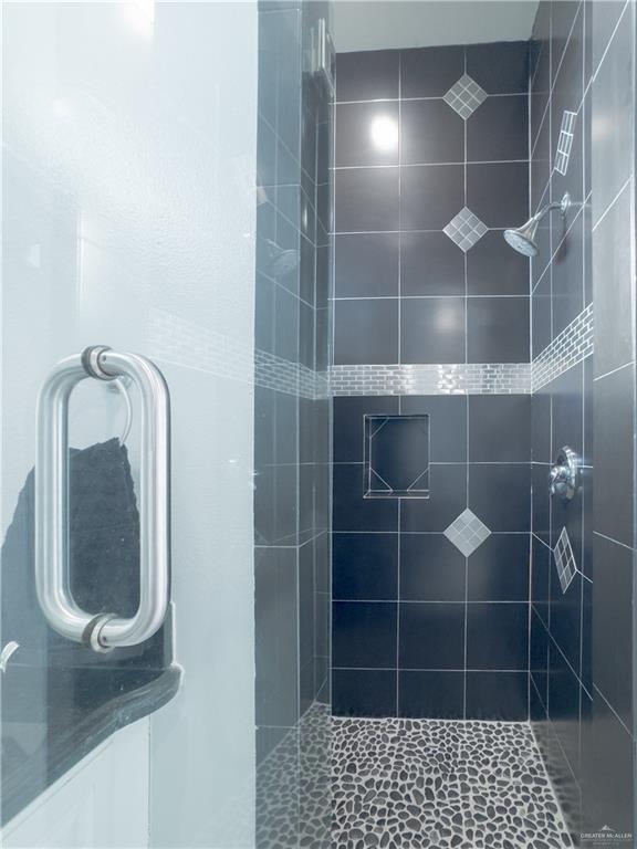2511 Wisteria Street Rio Grande City, TX 78582 - Photo 20 of 27 a bathroom with a glass shower