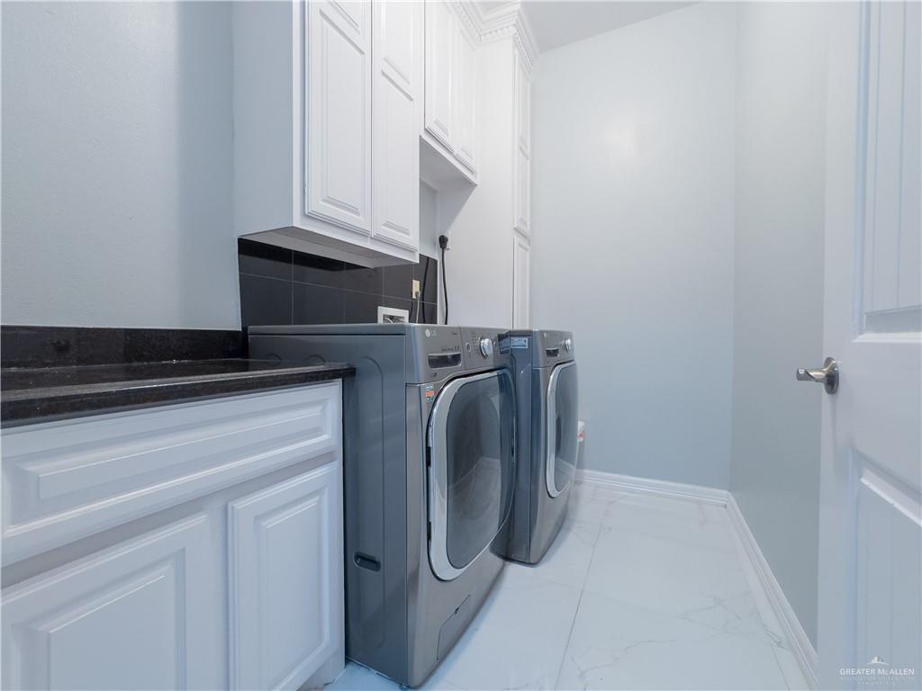 2511 Wisteria Street Rio Grande City, TX 78582 - Photo 22 of 27 a utility room with dryer and washer