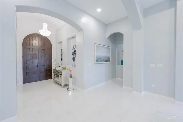 wooden floor in an empty room with a mirror