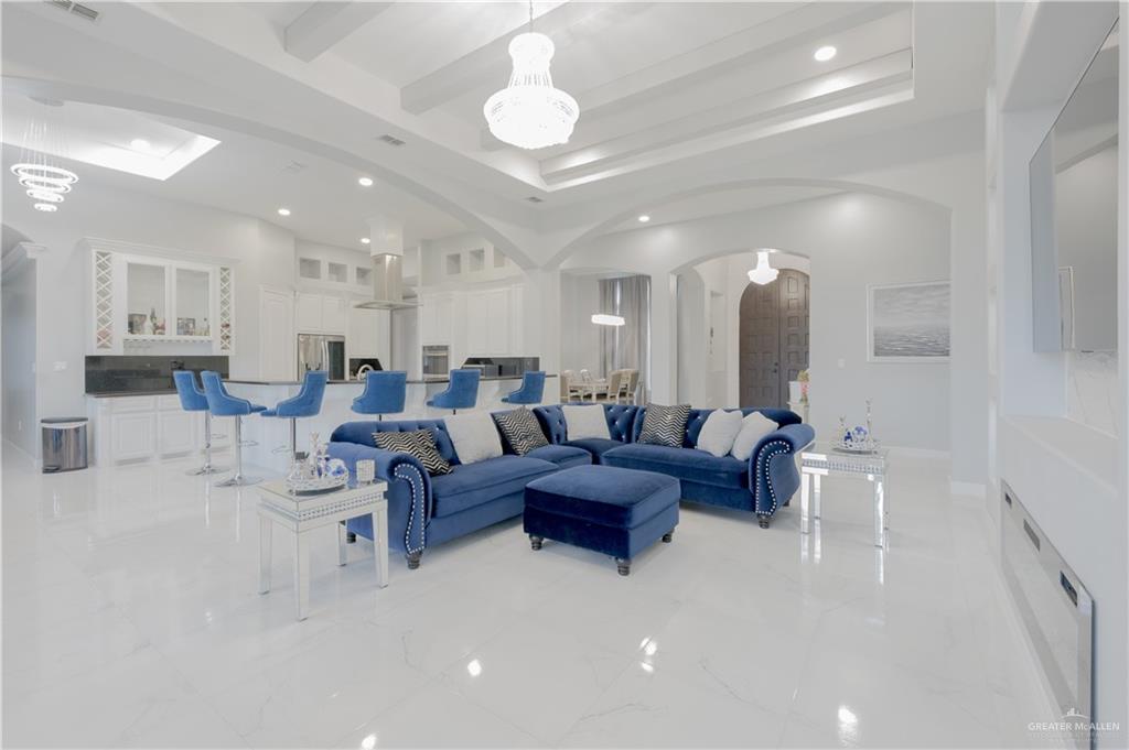 2511 Wisteria Street Rio Grande City, TX 78582 - Photo 5 of 27 a living room with lots of furniture and a chandelier