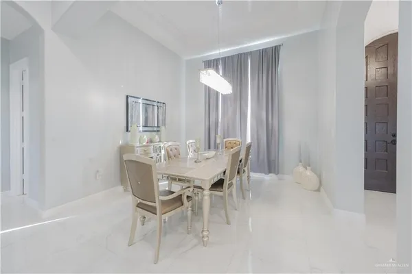 a dining room with furniture and window