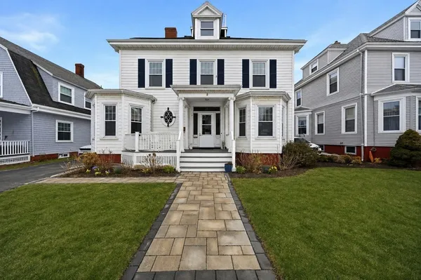 a front view of a house with a yard