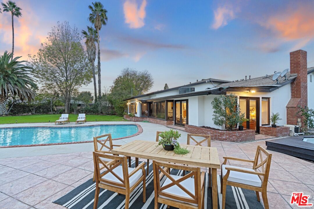 20650 Stagg Street Winnetka, CA 91306 - Photo 2 of 42 a view of a house with a yard and sitting area