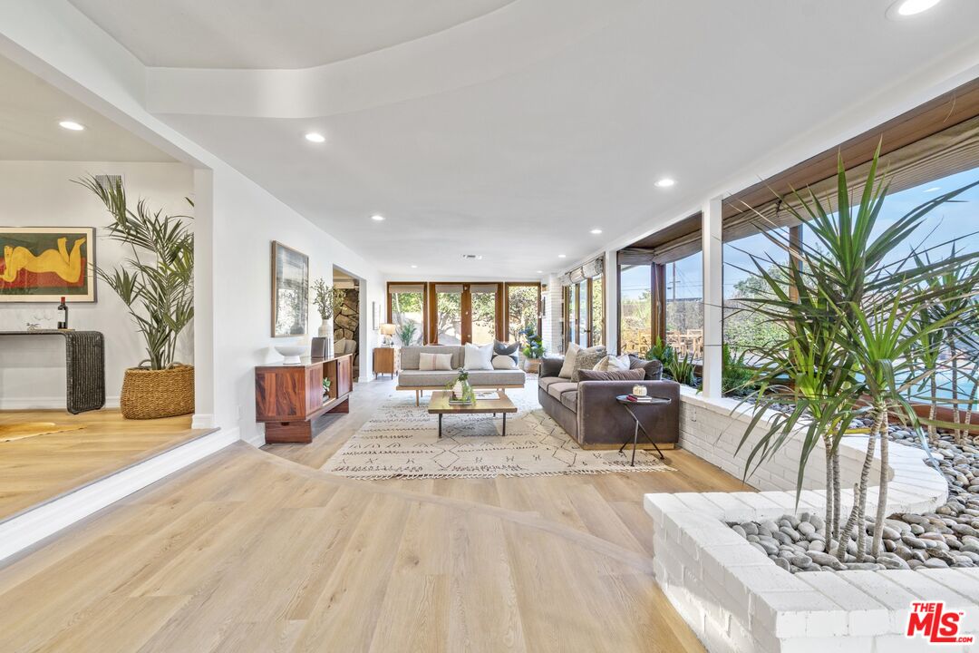 20650 Stagg Street Winnetka, CA 91306 - Photo 12 of 42 a living room with furniture and a large window
