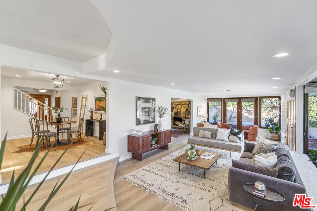 20650 Stagg Street Winnetka, CA 91306 - Photo 13 of 42 a living room with furniture and a table